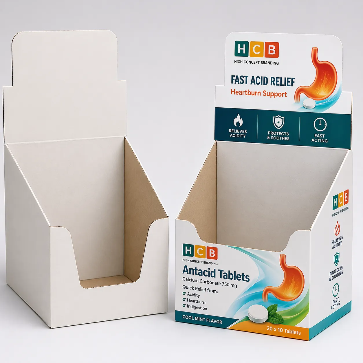 Two cardboard boxes with hanging tabs, featuring orange citrus artwork and antacid tablet product information. class=